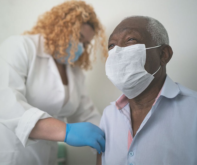 nurse with male patient with masks on